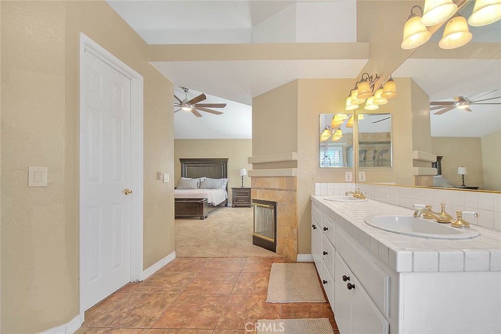 28832 Harwick Drive Highland, CA 92346 - Photo 43 of 62 a en suite bathroom with a double vanity sink mirror and