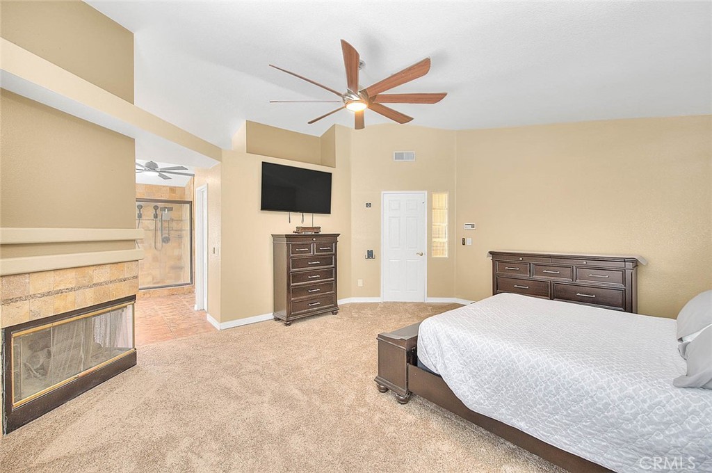 28832 Harwick Drive Highland, CA 92346 - Photo 53 of 62 a bedroom with a bed and a flat screen tv