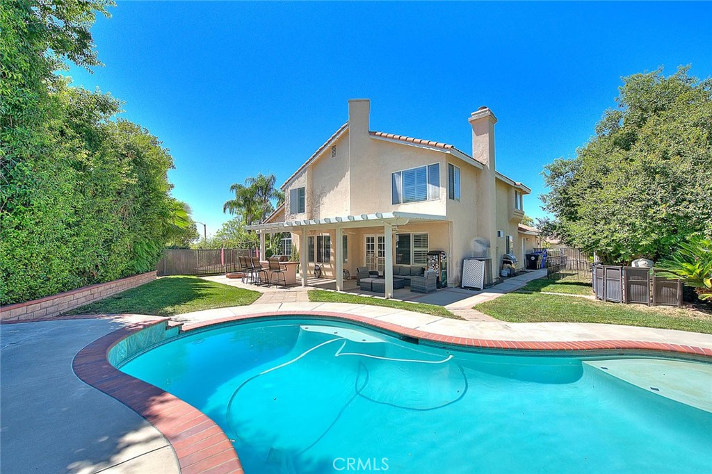28832 Harwick Drive Highland, CA 92346 - Photo 56 of 62 a swimming pool with outdoor seating and yard