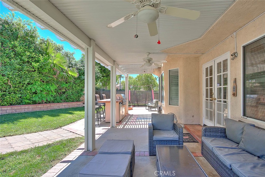 28832 Harwick Drive Highland, CA 92346 - Photo 59 of 62 a outdoor space with patio the couches and a dining table with garden view