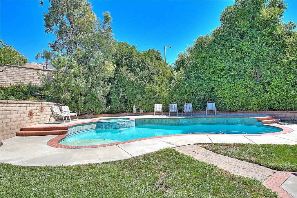 28832 Harwick Drive Highland, CA 92346 - Photo 60 of 62 a view of a swimming pool with a yard