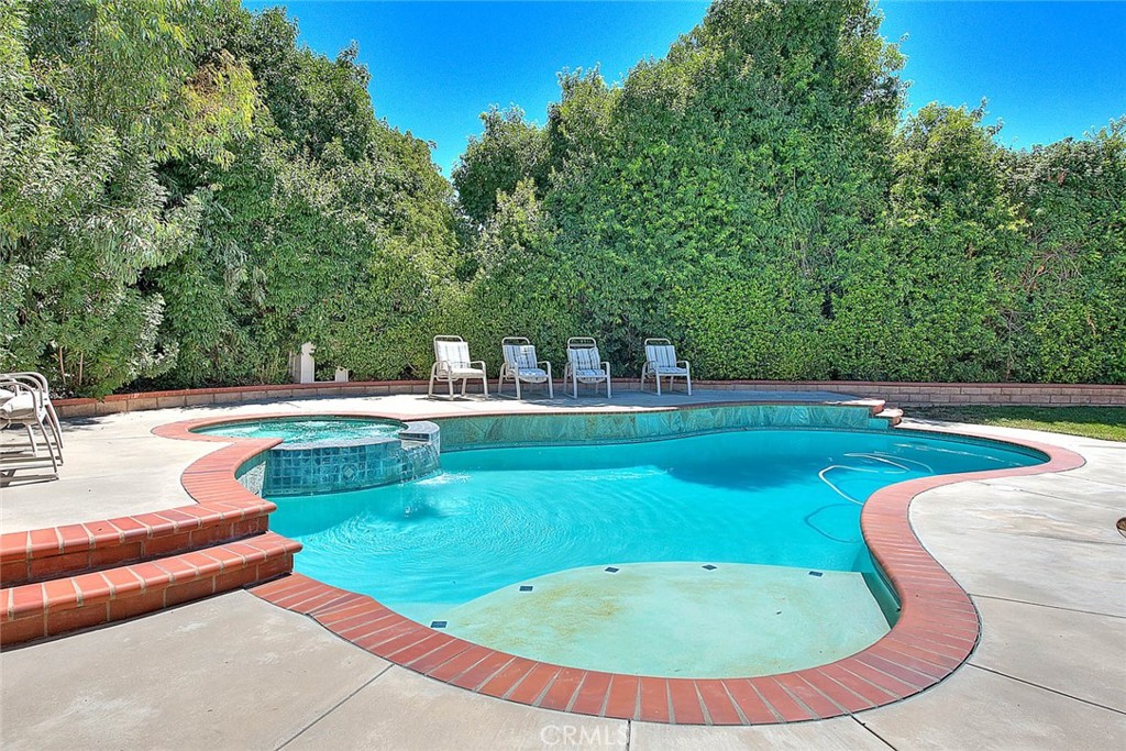 28832 Harwick Drive Highland, CA 92346 - Photo 61 of 62 a view of a swimming pool with a yard