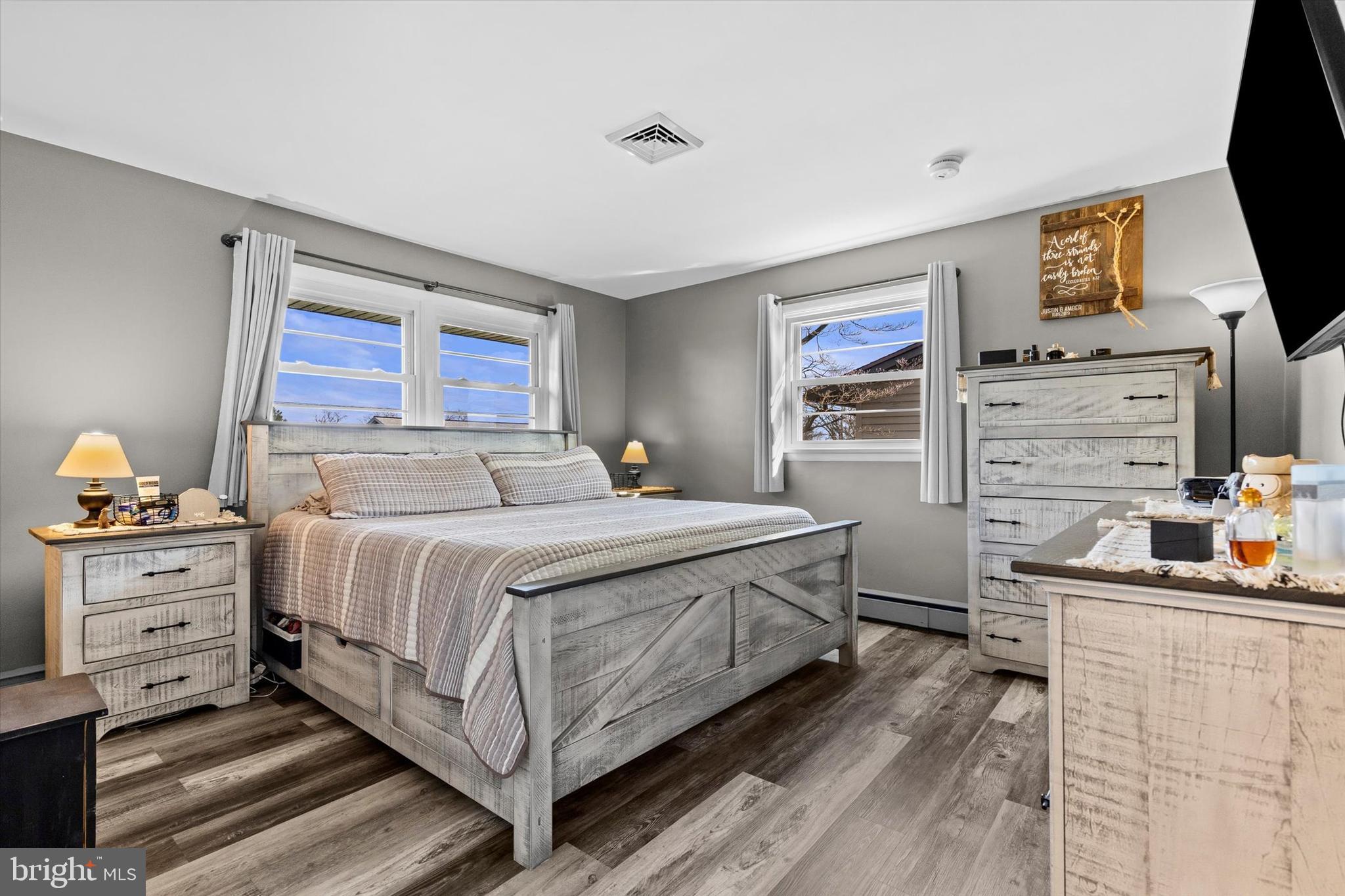 239 Mill Road Mount Joy, PA 17552 - Photo 19 of 42 a bedroom with a bed and a flat screen tv