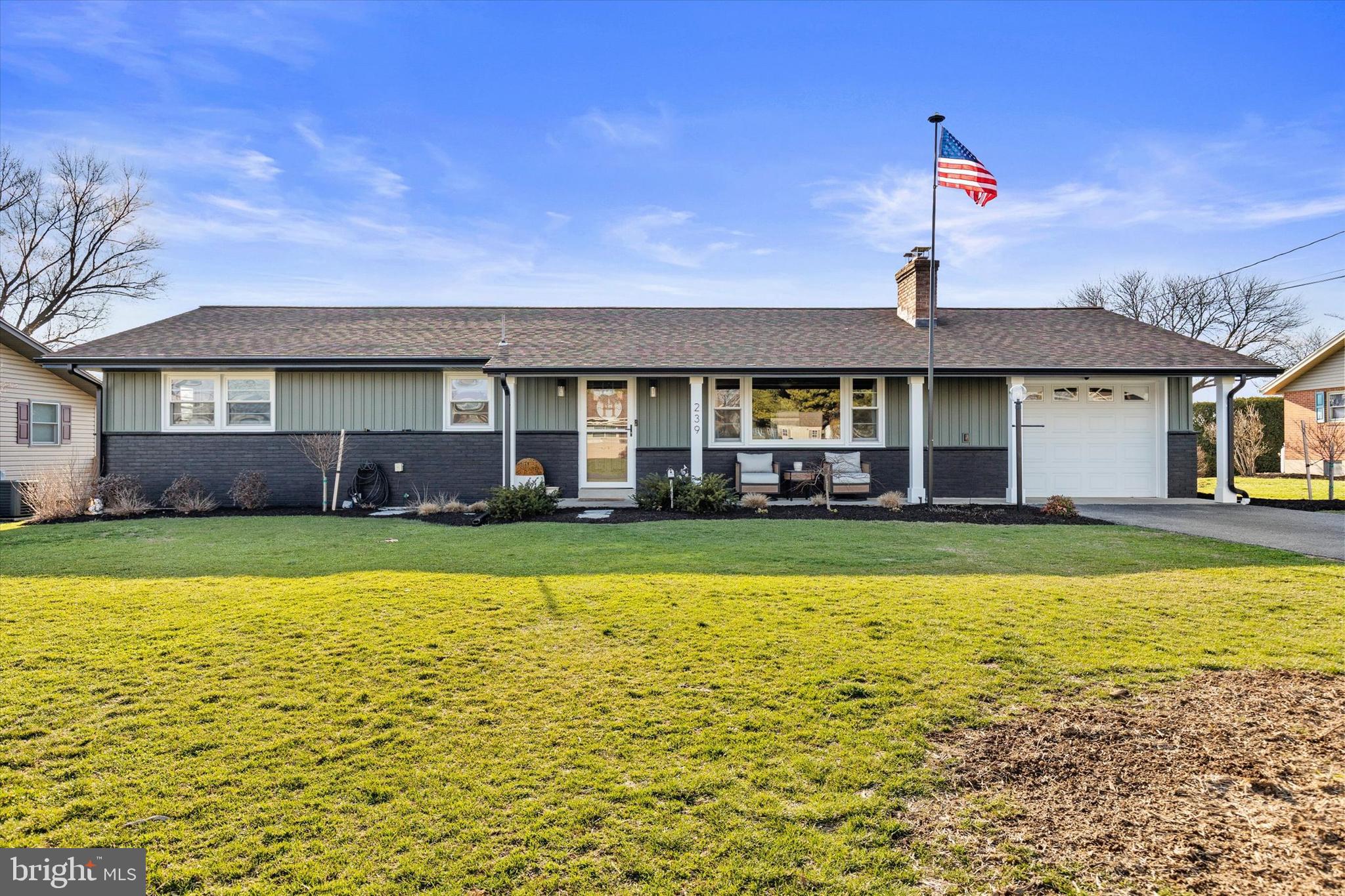 239 Mill Road Mount Joy, PA 17552 - Photo 2 of 42 a front view of a house with swimming pool having outdoor seating