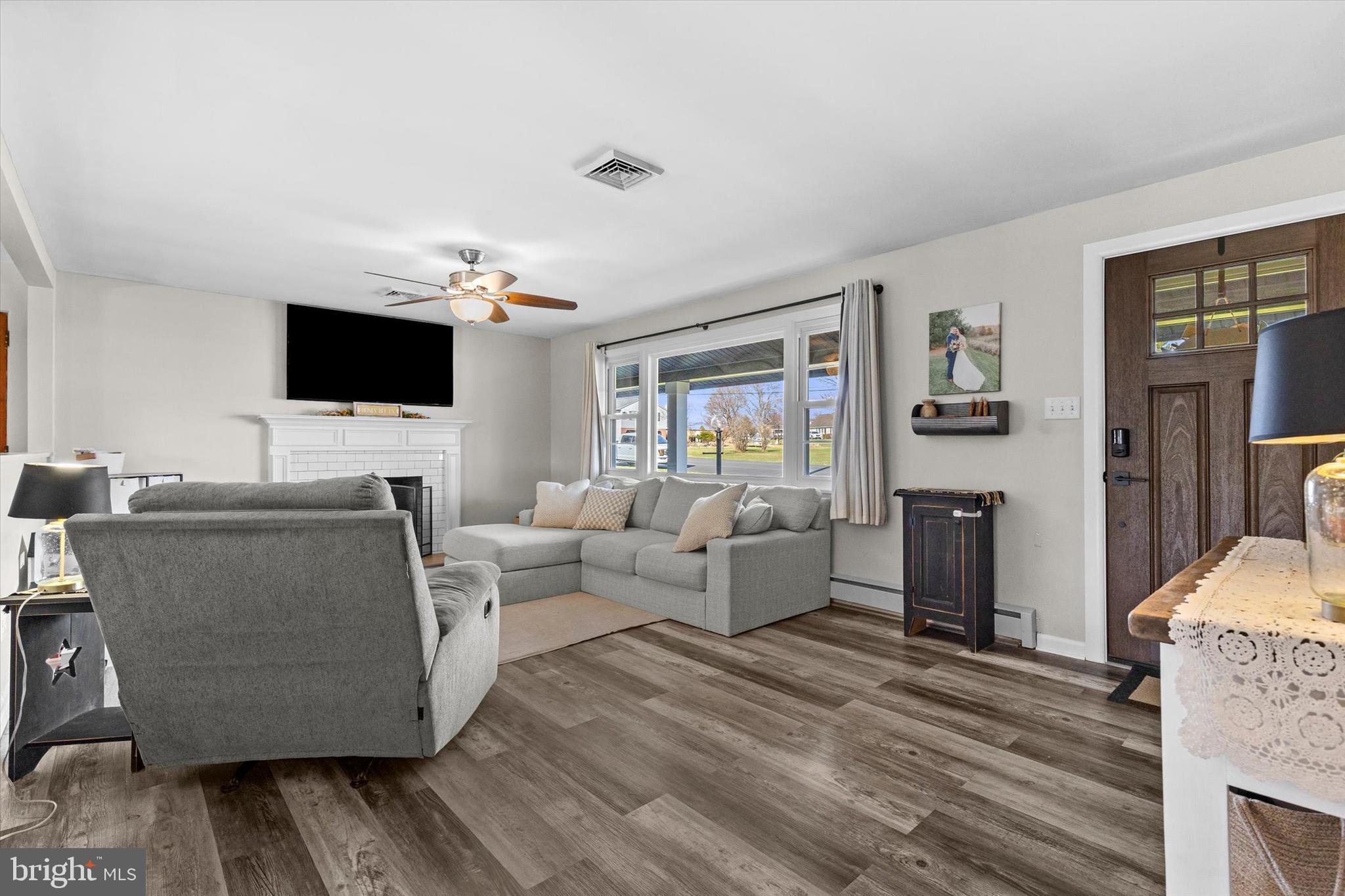 239 Mill Road Mount Joy, PA 17552 - Photo 6 of 42 a living room with furniture and a flat screen tv