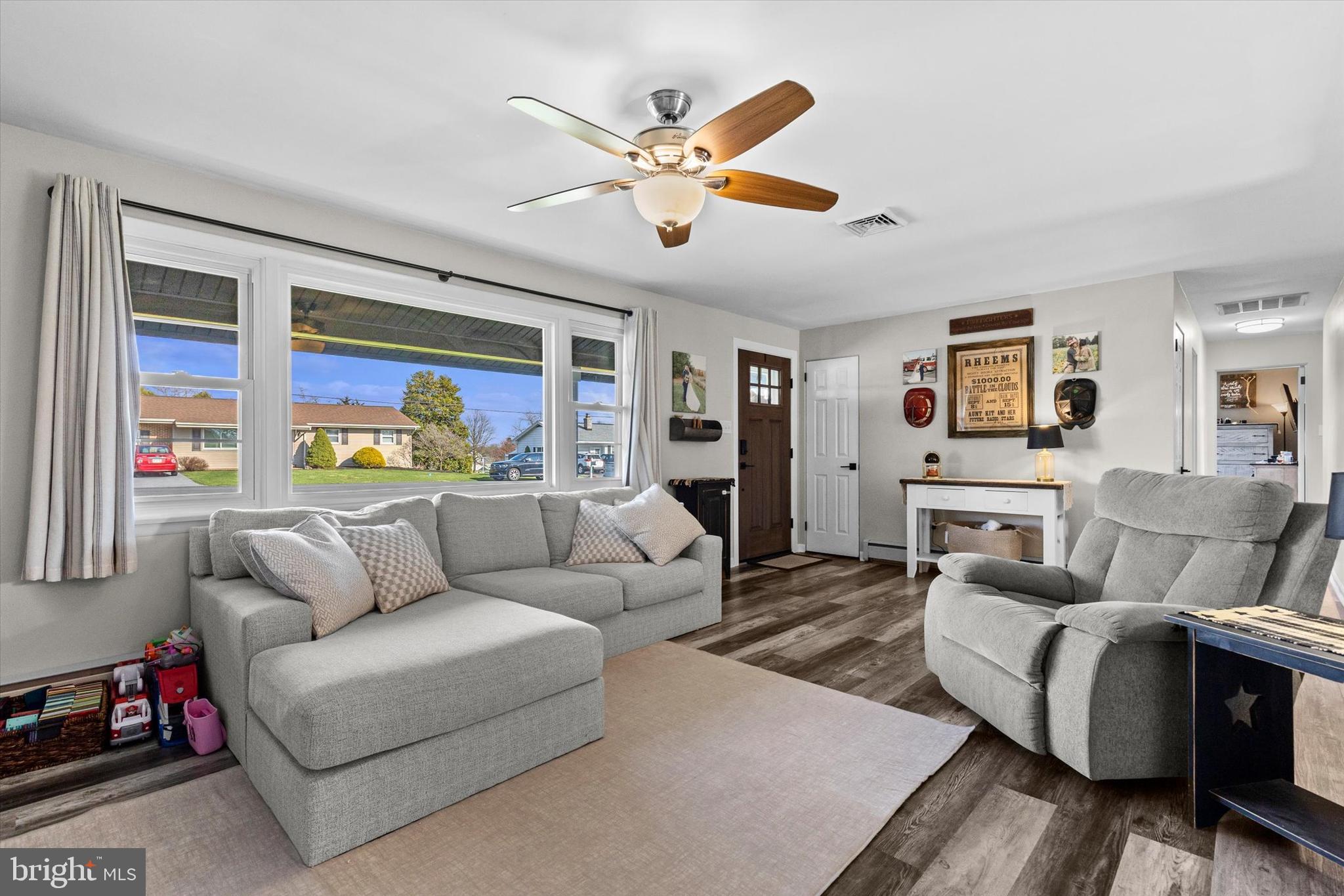 239 Mill Road Mount Joy, PA 17552 - Photo 7 of 42 a living room with furniture ceiling fan and a window