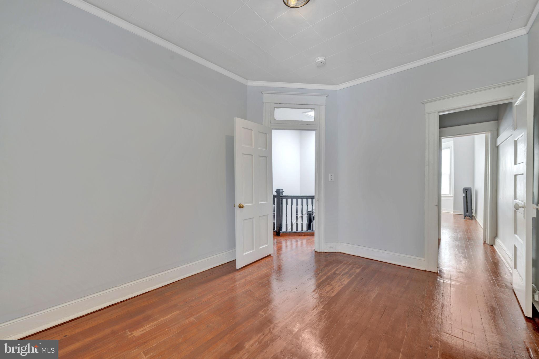 2822 Riggs Avenue Baltimore, MD 21216 - Photo 19 of 30 a view of a room with wooden floor