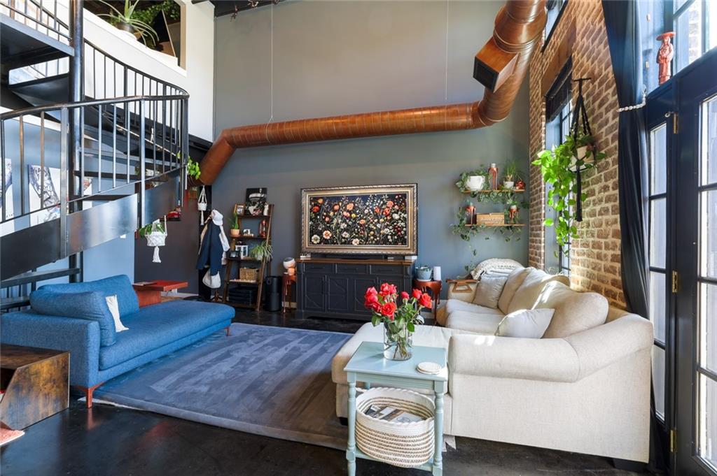 5434 Peachtree Road, Unit 109 Atlanta, GA 30341 - Photo 2 of 32 a living room with furniture and flowers