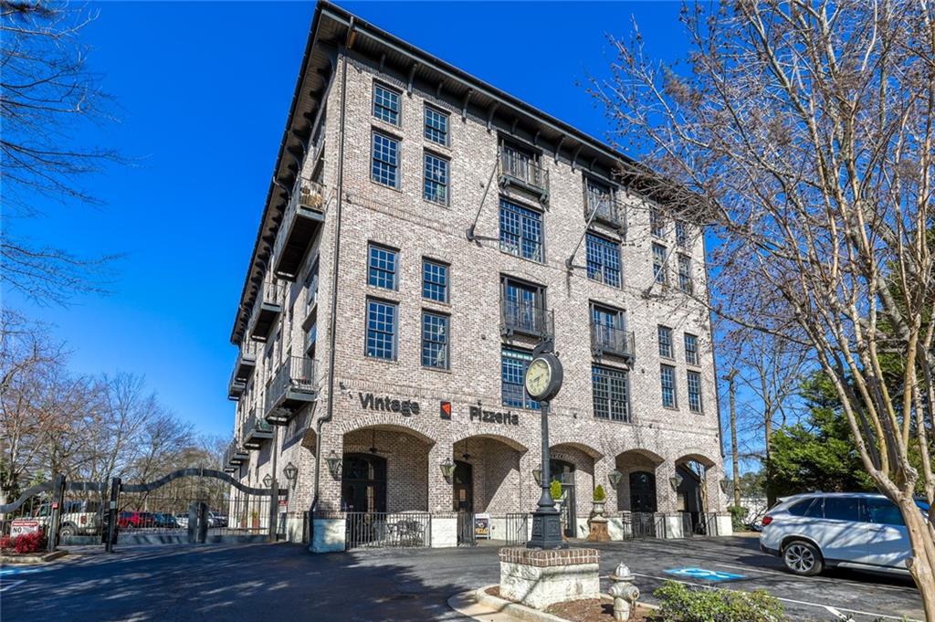 5434 Peachtree Road, Unit 109 Atlanta, GA 30341 - Photo 22 of 32 a couple of cars parked in front of a building