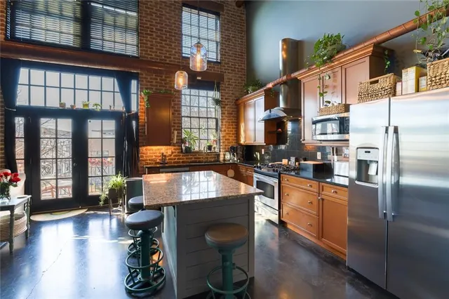 a kitchen with sink refrigerator and window