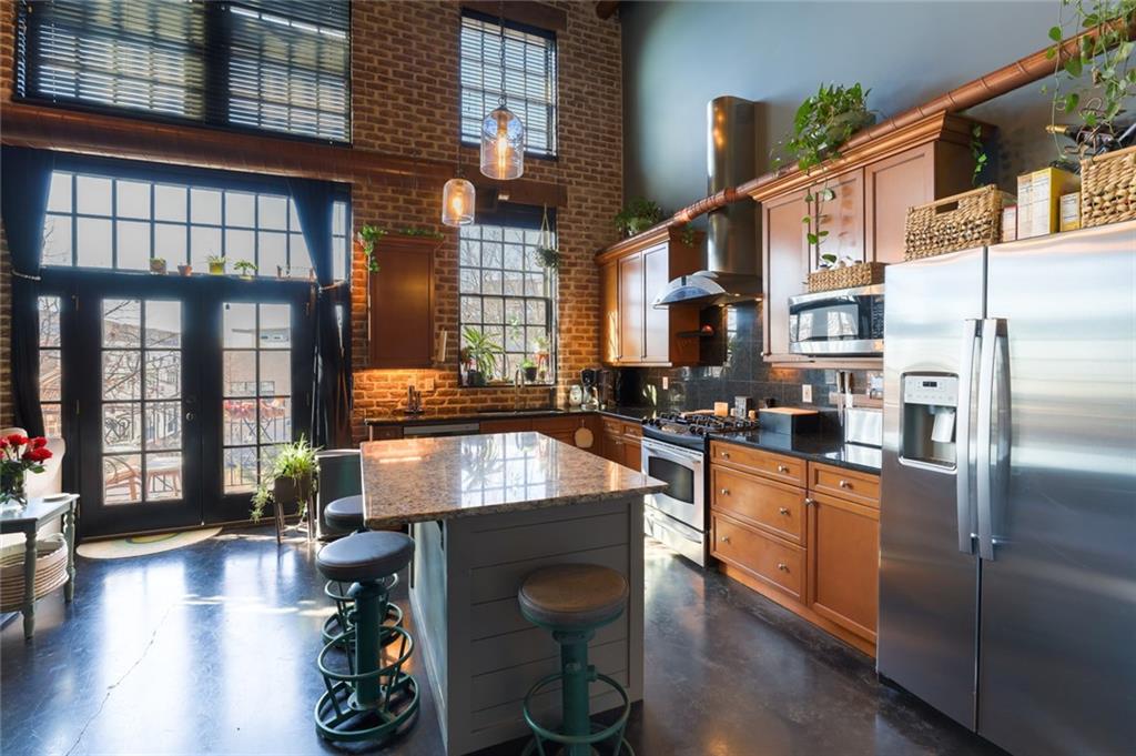5434 Peachtree Road, Unit 109 Atlanta, GA 30341 - Photo 3 of 32 a kitchen with sink refrigerator and window