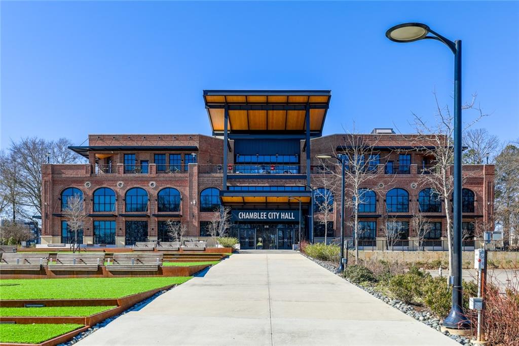 5434 Peachtree Road, Unit 109 Atlanta, GA 30341 - Photo 32 of 32 a front view of a house with swimming pool and glass windows