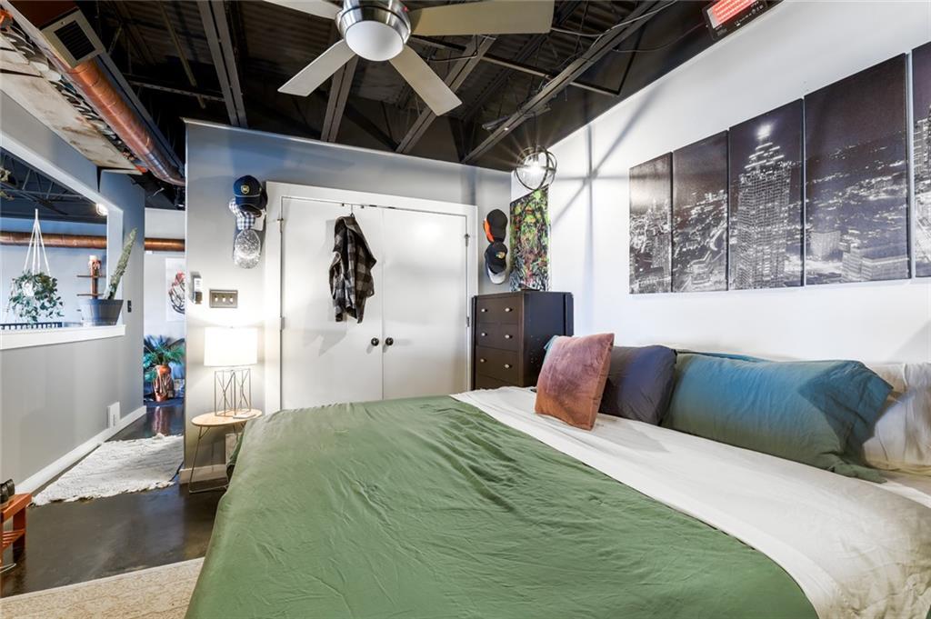 5434 Peachtree Road, Unit 109 Atlanta, GA 30341 - Photo 8 of 32 a bedroom with a large bed and a window