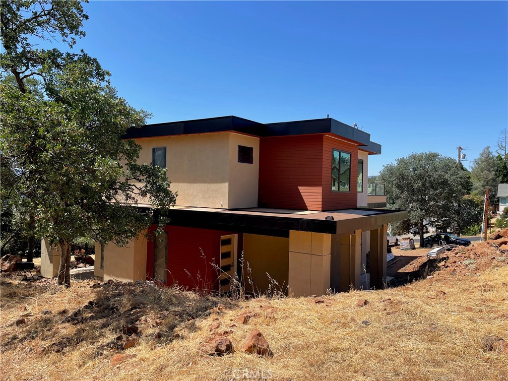 17234 Brookfield Road Hidden Valley Lake, CA 95467 - Photo 1 of 6 a front view of a house with a yard