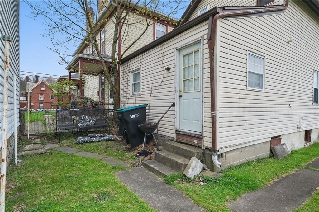 26 May Avenue McKees Rocks, PA 15136 - Photo 20 of 28 a view of backyard with a chair under a house