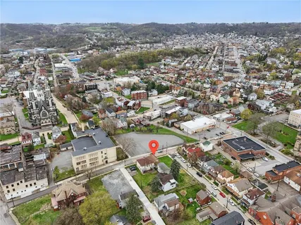 an aerial view of residential houses with outdoor space