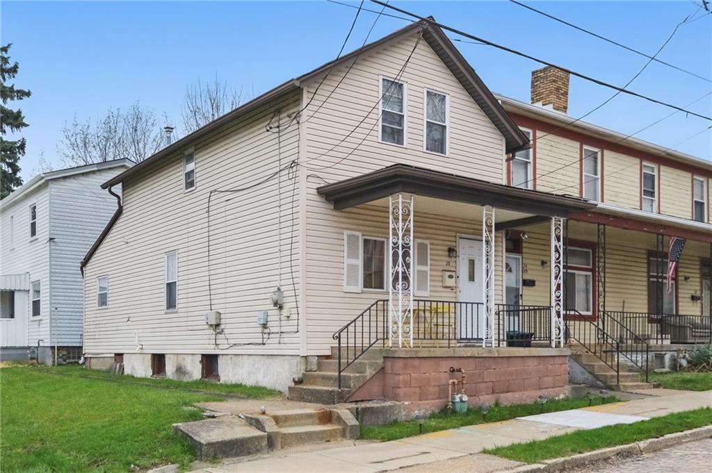 26 May Avenue McKees Rocks, PA 15136 - Photo 3 of 28 a front view of a house with a yard