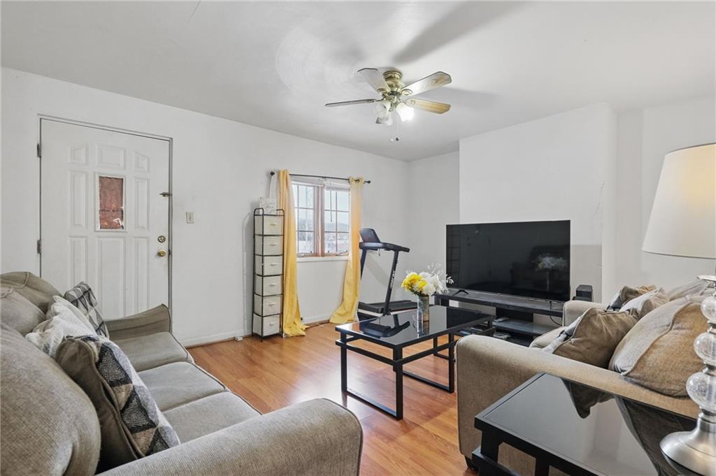 26 May Avenue McKees Rocks, PA 15136 - Photo 7 of 28 a living room with furniture and a flat screen tv