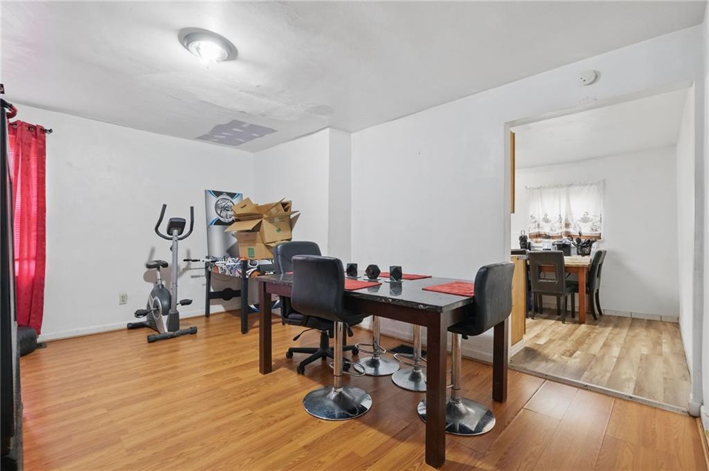 26 May Avenue McKees Rocks, PA 15136 - Photo 8 of 28 a view of a workspace with furniture and wooden floor