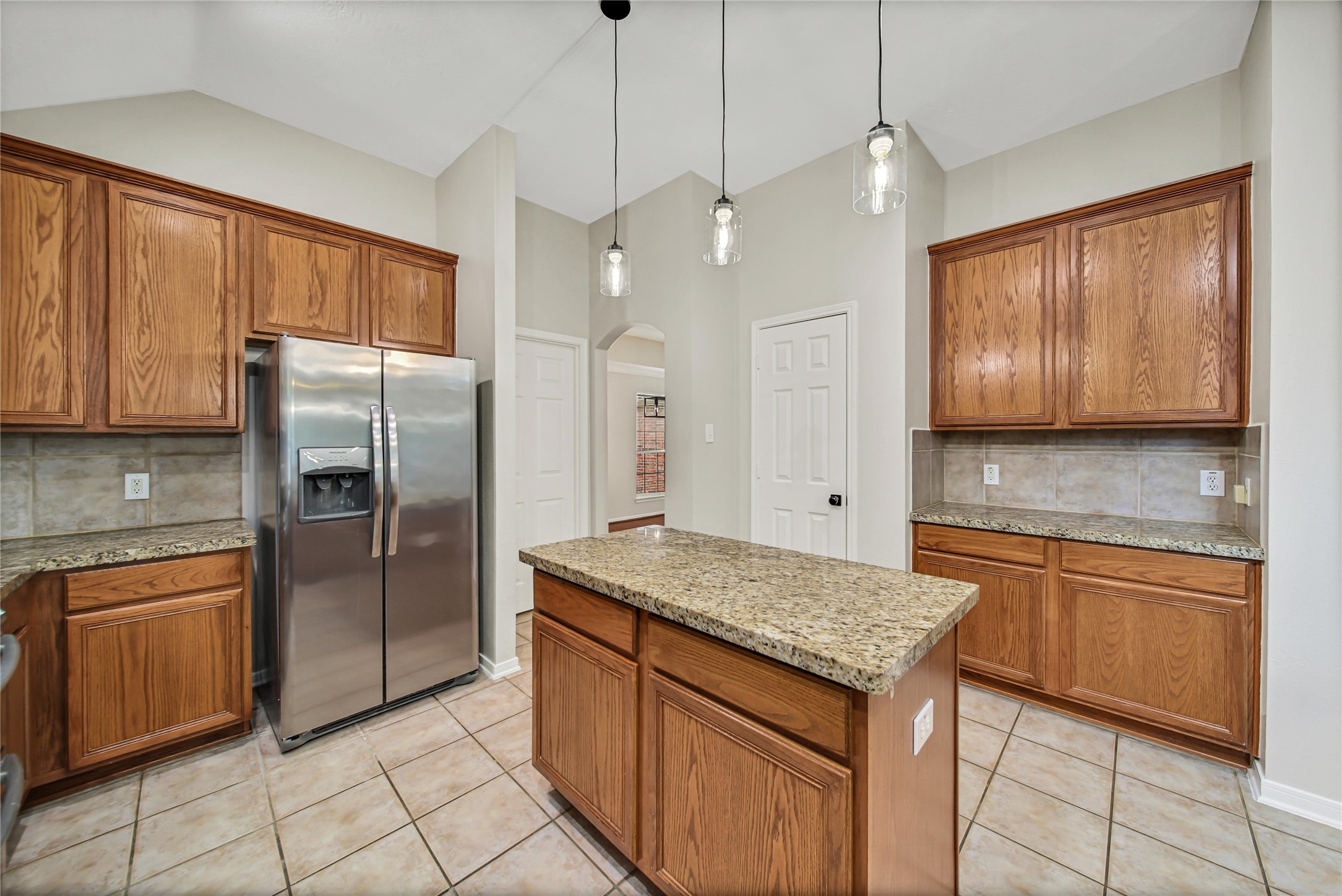 14526 Red Tailed Hawk Lane Houston, TX 77044 - Photo 13 of 40 a kitchen with stainless steel appliances granite countertop a refrigerator and a sink