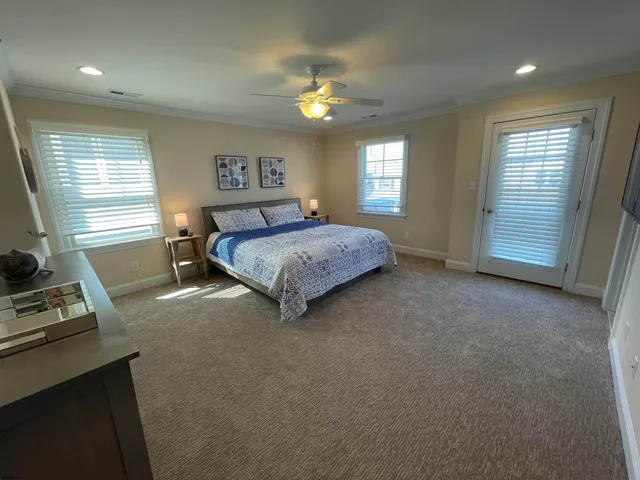 a spacious bedroom with a bed and a window