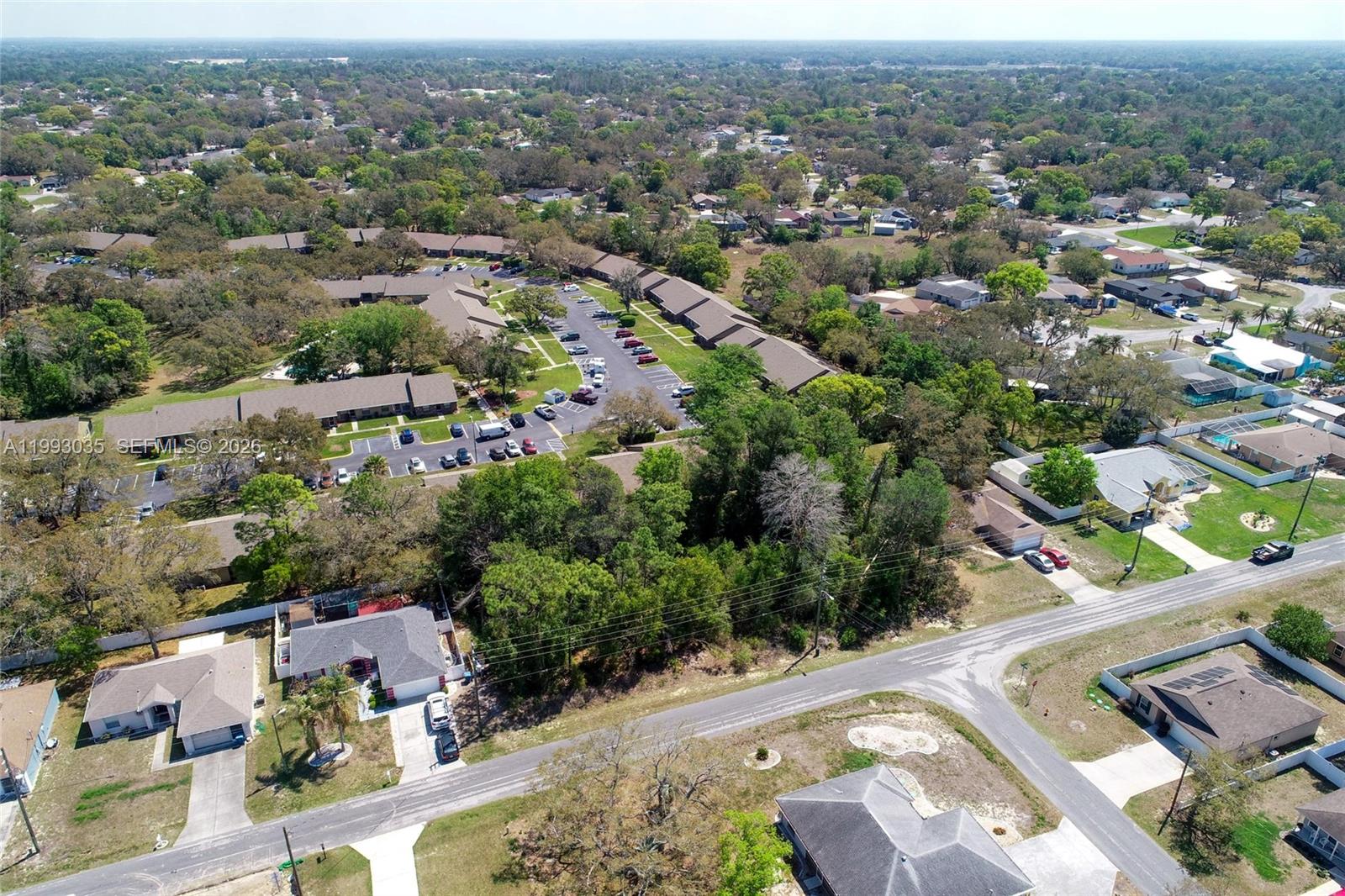 1 Tomahawk Avenue Spring Hill, FL 34606 - Photo 15 of 20 an aerial view of multiple house