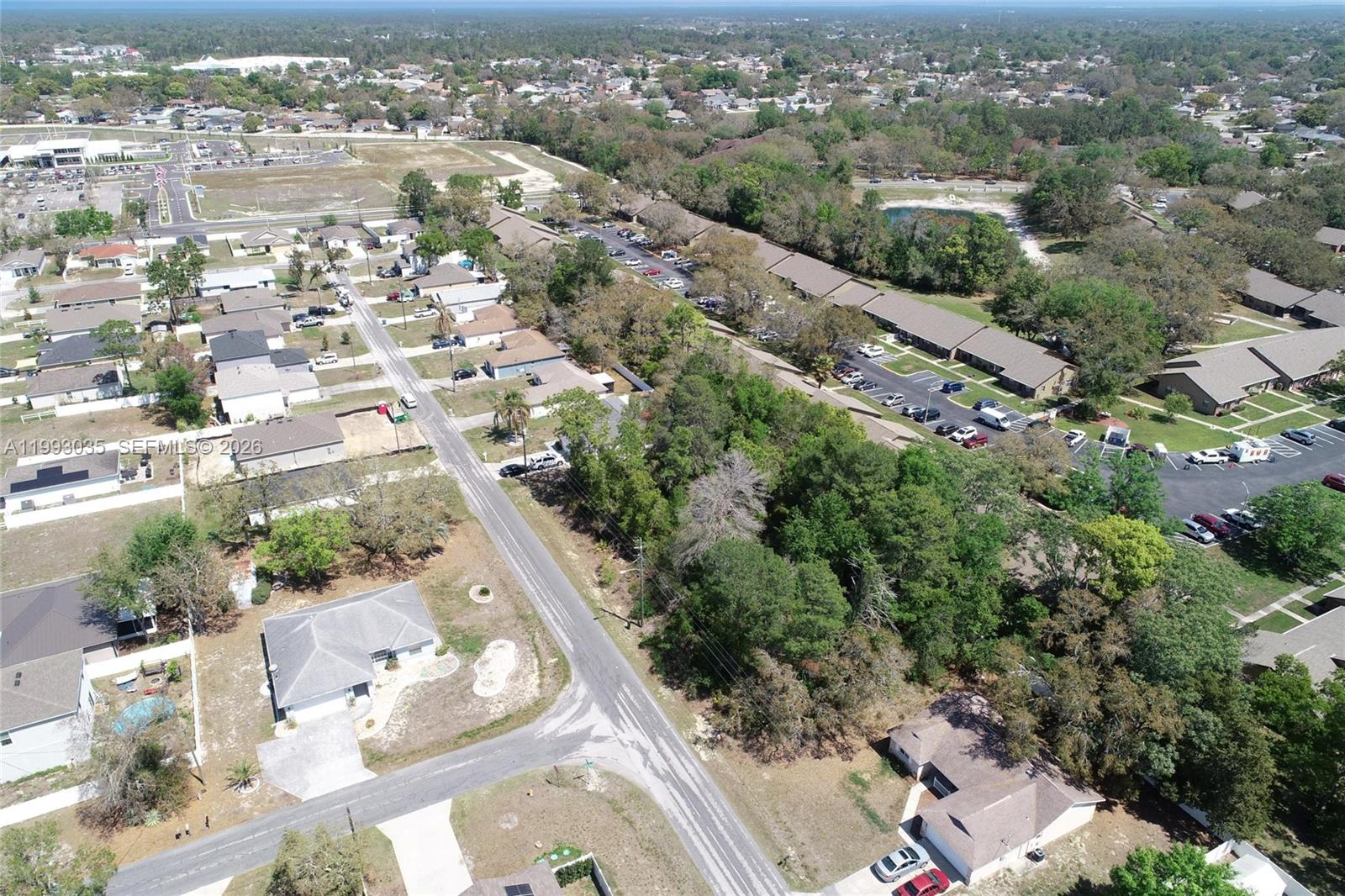 1 Tomahawk Avenue Spring Hill, FL 34606 - Photo 16 of 20 an aerial view of residential houses with outdoor space