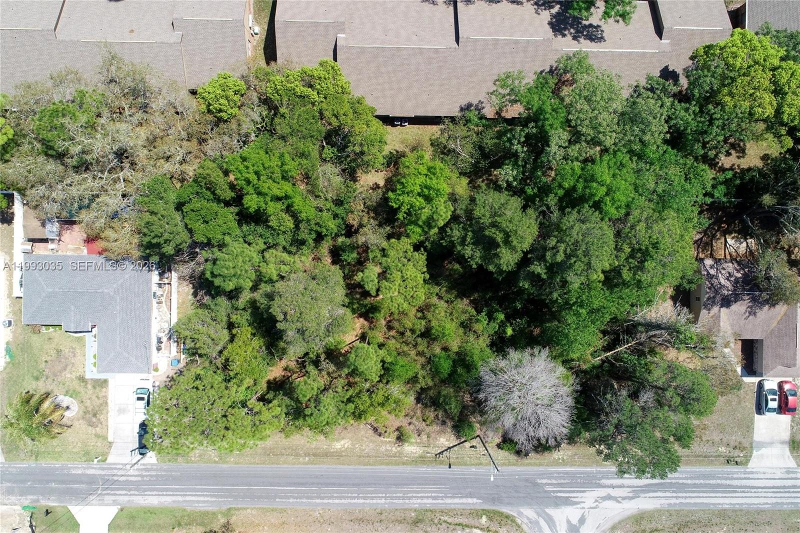 1 Tomahawk Avenue Spring Hill, FL 34606 - Photo 18 of 20 an aerial view of a house with a yard and outdoor space