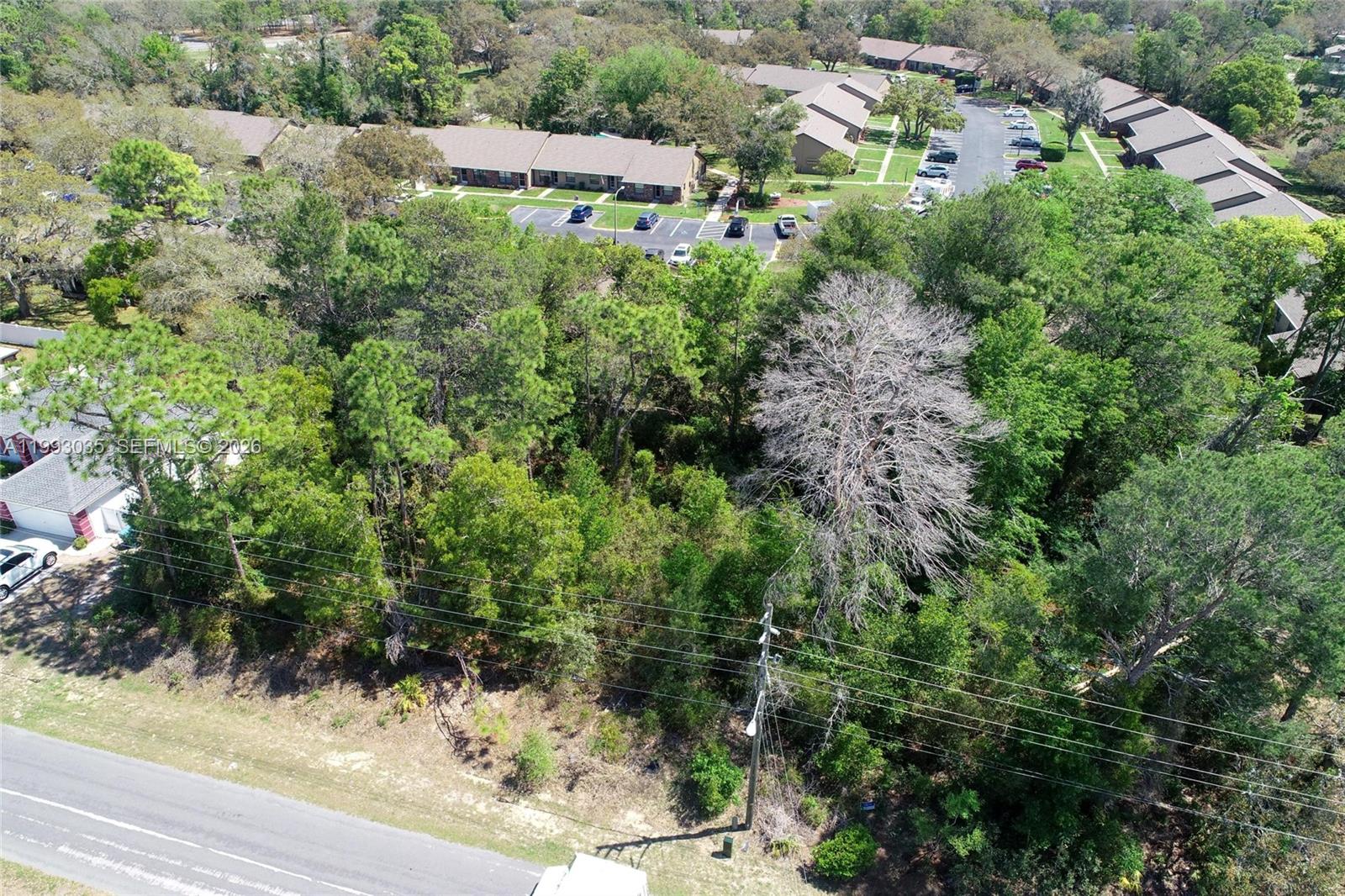 1 Tomahawk Avenue Spring Hill, FL 34606 - Photo 20 of 20 an aerial view of a house with a yard