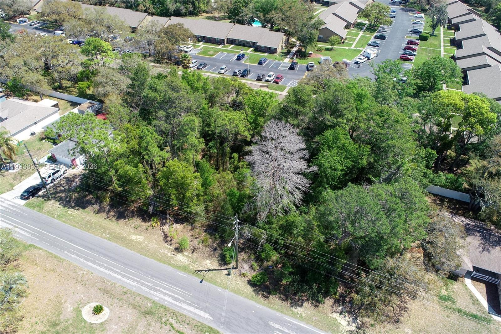 1 Tomahawk Avenue Spring Hill, FL 34606 - Photo 9 of 20 an aerial view of residential house with outdoor space