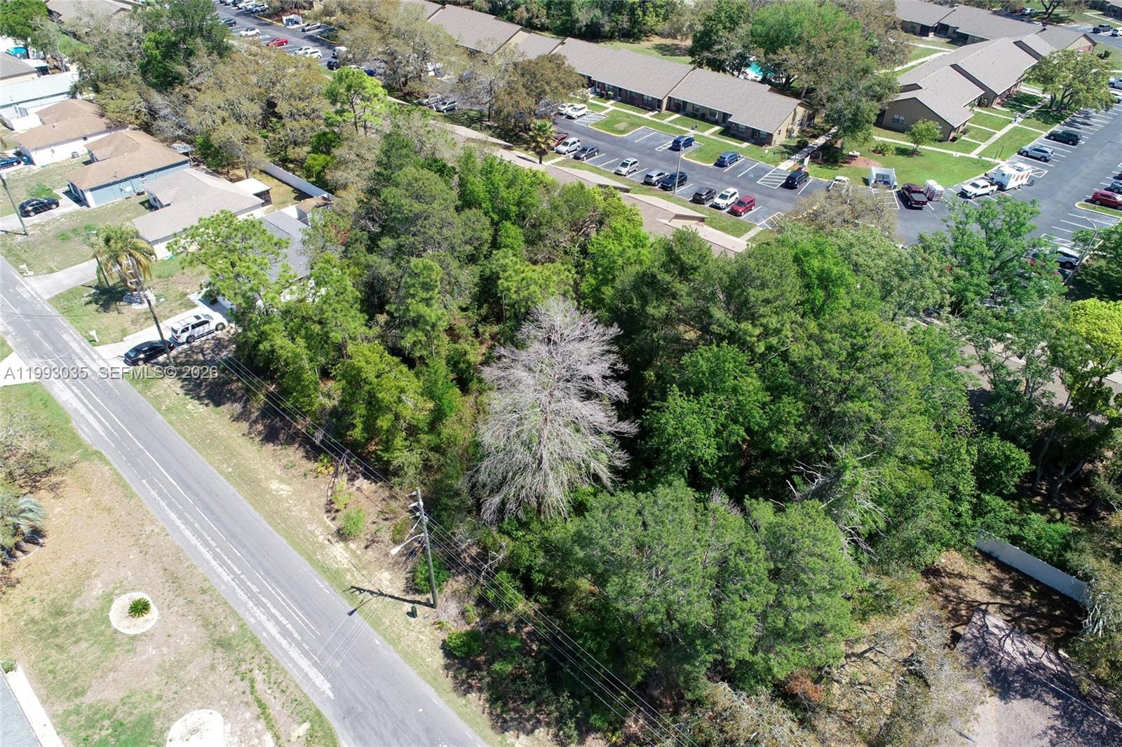 1 Tomahawk Avenue Spring Hill, FL 34606 - Photo 10 of 20 an aerial view of multiple houses with yard