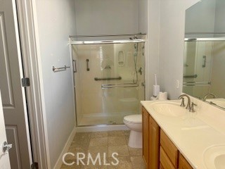 10495 Bridge Haven Road Apple Valley, CA 92308 - Photo 11 of 19 a bathroom with a sink a toilet and shower
