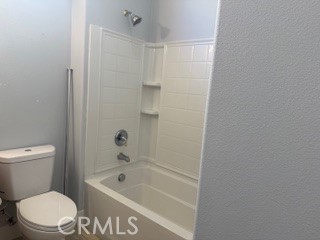 10495 Bridge Haven Road Apple Valley, CA 92308 - Photo 13 of 19 a bathroom with a bathtub a toilet and a shower