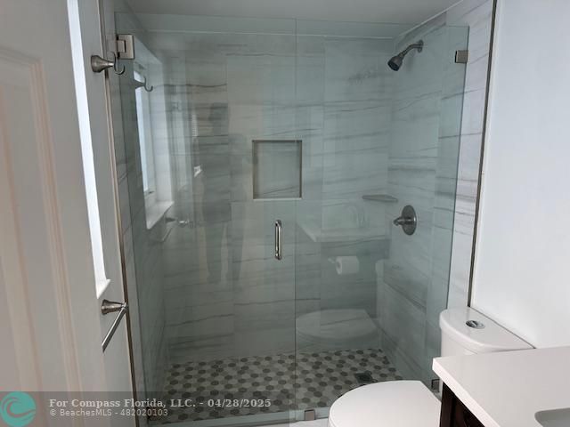 7605 Northwest 5th Court, Unit 208 Margate, FL 33063 - Photo 11 of 25 a bathroom with a shower and a toilet