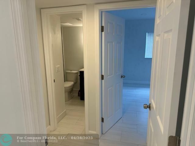7605 Northwest 5th Court, Unit 208 Margate, FL 33063 - Photo 12 of 25 a view of a bathroom from a hallway