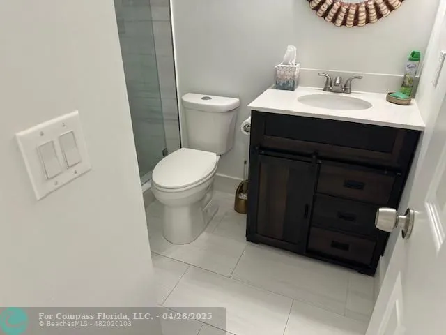 a bathroom with a sink toilet and vanity