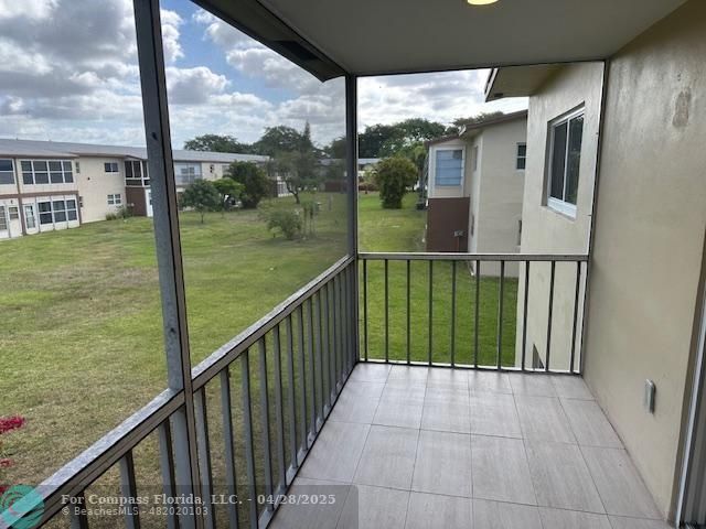 7605 Northwest 5th Court, Unit 208 Margate, FL 33063 - Photo 17 of 25 a view of balcony with a yard
