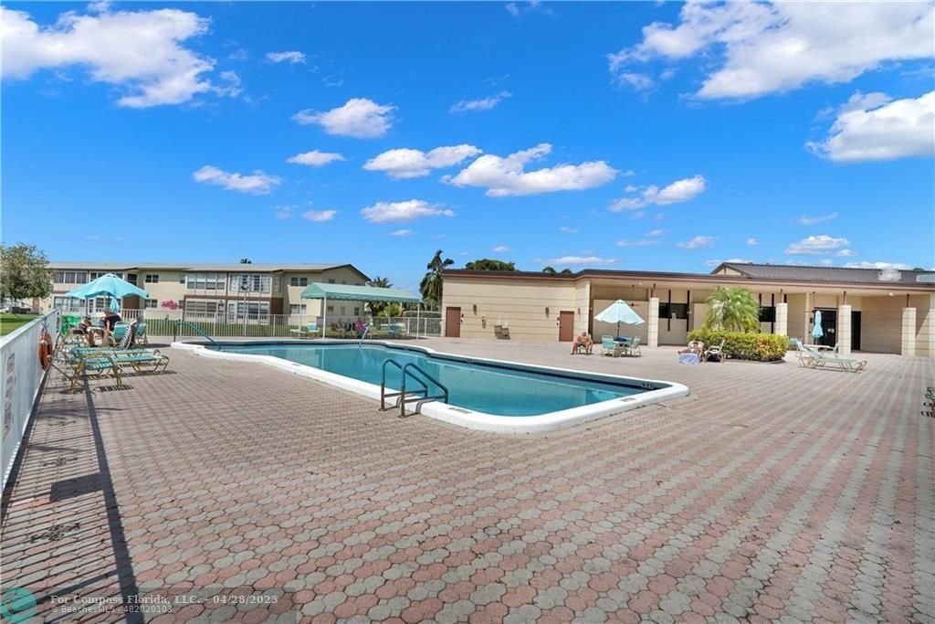 7605 Northwest 5th Court, Unit 208 Margate, FL 33063 - Photo 20 of 25 a balcony with table and chairs