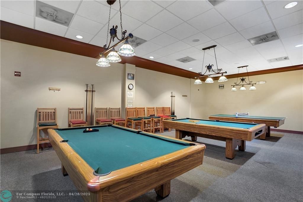 7605 Northwest 5th Court, Unit 208 Margate, FL 33063 - Photo 22 of 25 a room with pool table and windows