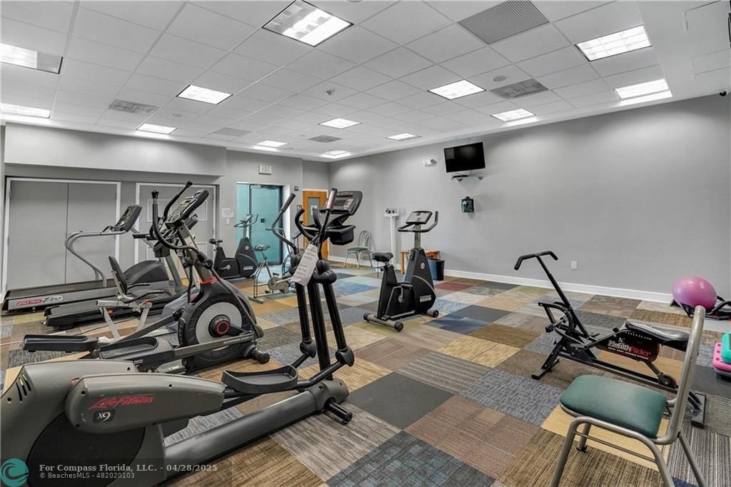 7605 Northwest 5th Court, Unit 208 Margate, FL 33063 - Photo 23 of 25 a view of a room with gym equipment