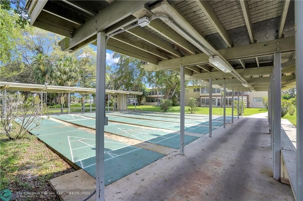 7605 Northwest 5th Court, Unit 208 Margate, FL 33063 - Photo 24 of 25 a view of a swimming pool with a porch