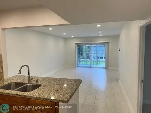 a kitchen with sink and window
