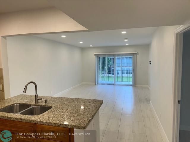 7605 Northwest 5th Court, Unit 208 Margate, FL 33063 - Photo 4 of 25 a kitchen with sink and window
