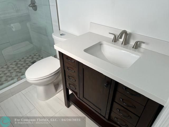 7605 Northwest 5th Court, Unit 208 Margate, FL 33063 - Photo 10 of 25 a bathroom with a sink toilet and shower