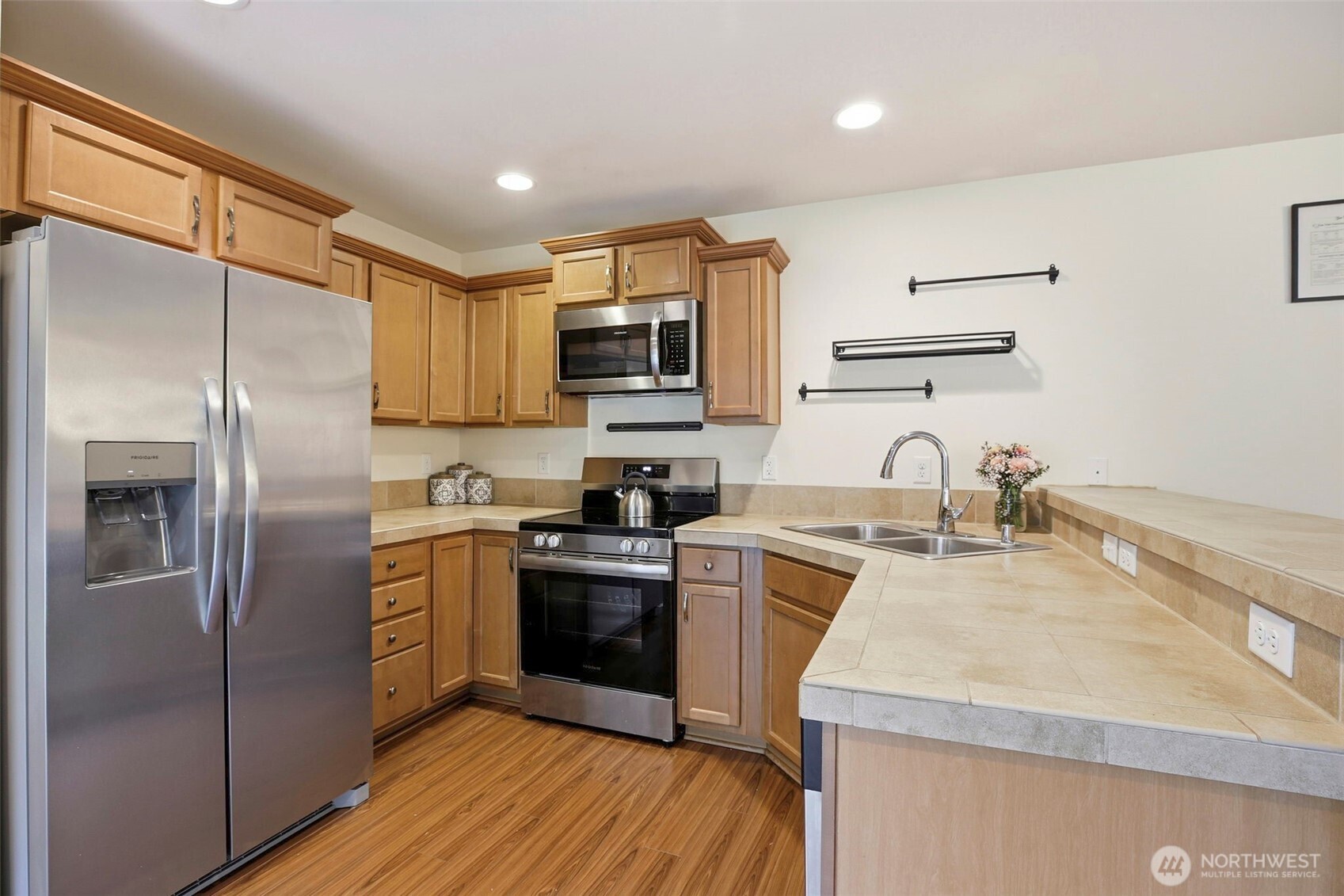 3662 London Loop Northeast Lacey, WA 98516 - Photo 17 of 40 a kitchen with a sink appliances and cabinets