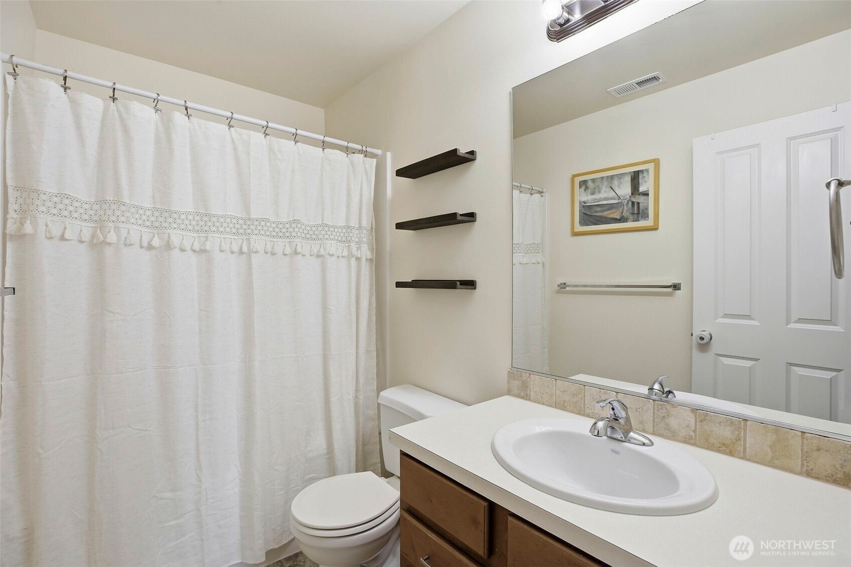 3662 London Loop Northeast Lacey, WA 98516 - Photo 32 of 40 a bathroom with a sink toilet and shower