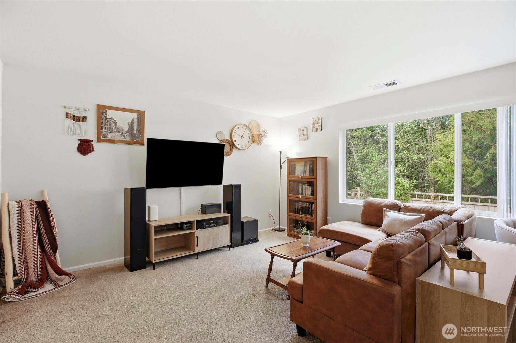 3662 London Loop Northeast Lacey, WA 98516 - Photo 10 of 40 a living room with furniture a flat screen tv and a window