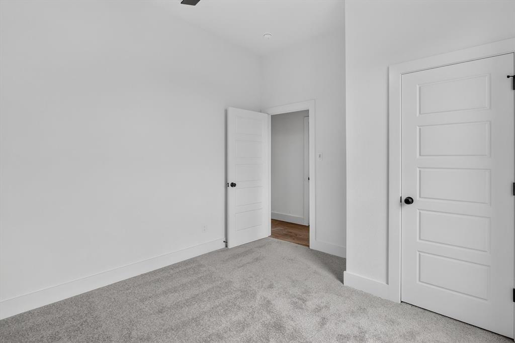 471 Red Bird Drive Springtown, TX 76082 - Photo 24 of 35 Crisp white walls with contrasting dark hardware and trim
