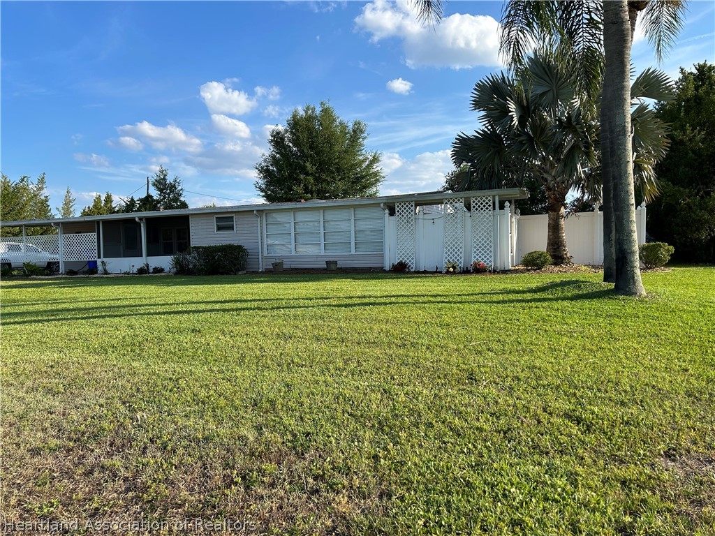 337 Hickory Ridge Drive Sebring, FL 33876 - Photo 1 of 48 a view of a house with a yard and potted plants