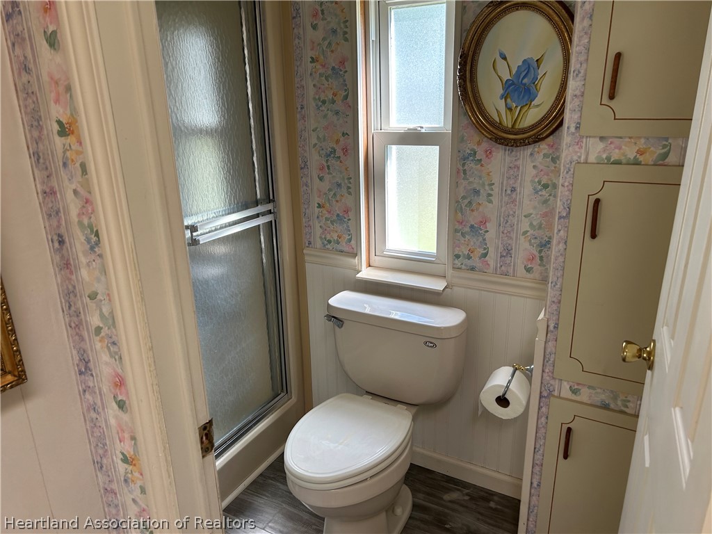 337 Hickory Ridge Drive Sebring, FL 33876 - Photo 17 of 48 a bathroom with a toilet and a mirror